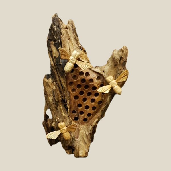Bees on Hive Hotel with three wooden Bees on the outside